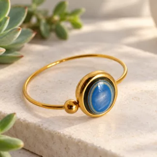 Bracelet bleu et doré Olympia créé à partir d'un ancien bouton